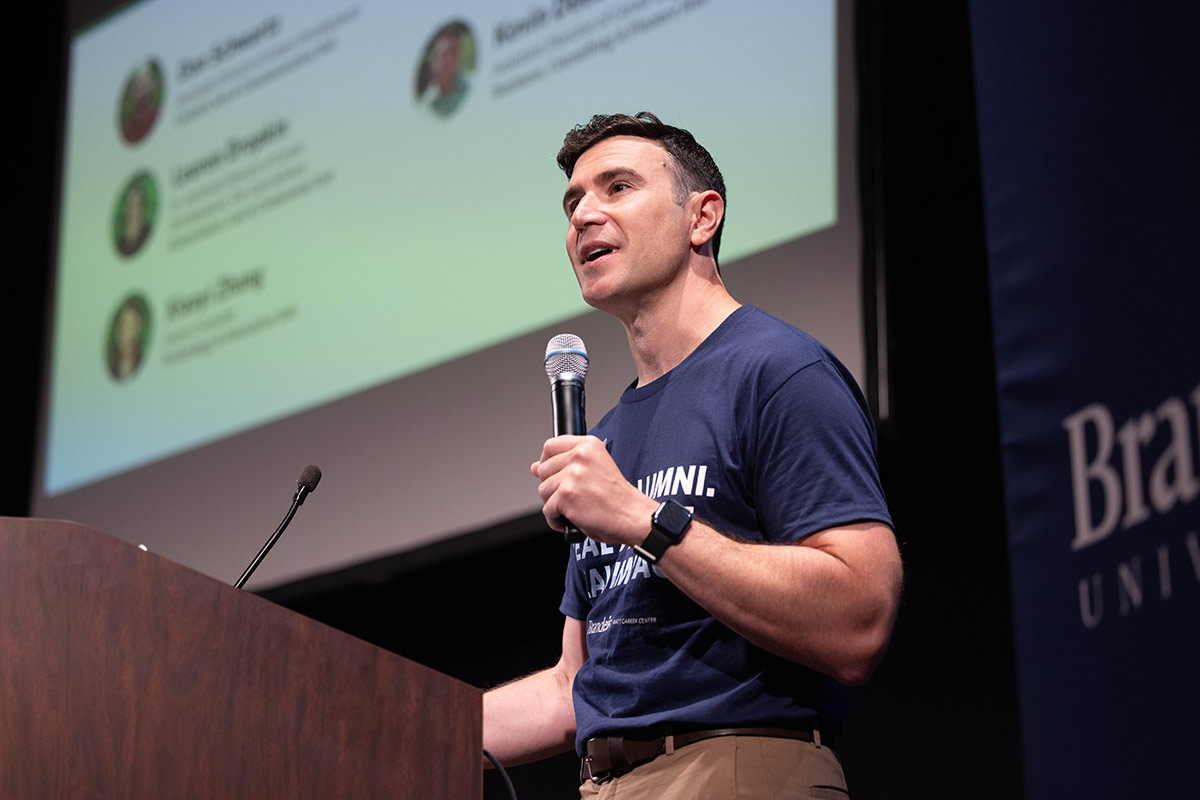 Jon Schlesinger stands on stage at a podium.