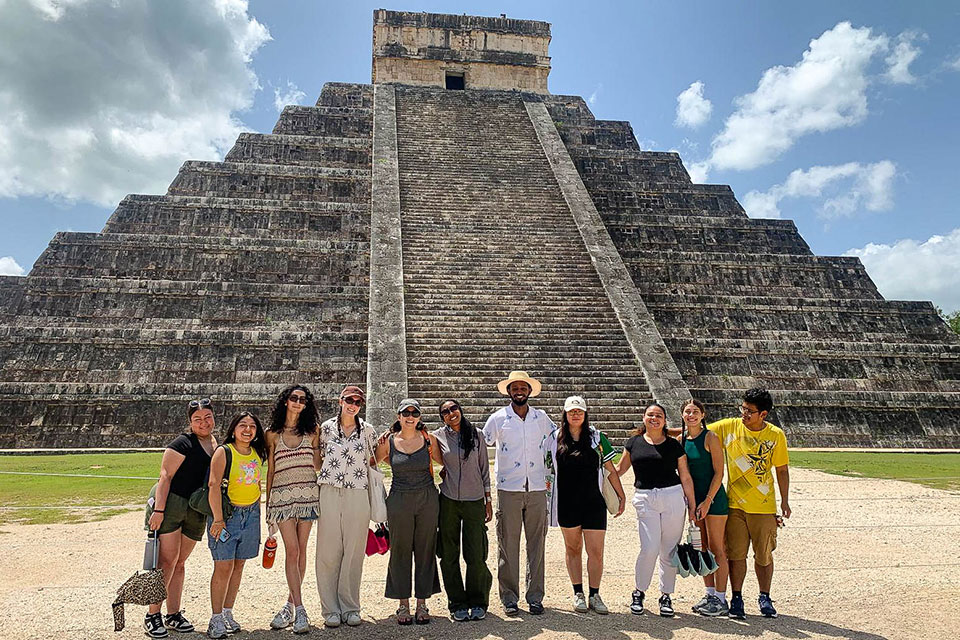 Samuel Hadego stands with classmates in front of Chichen Itza.