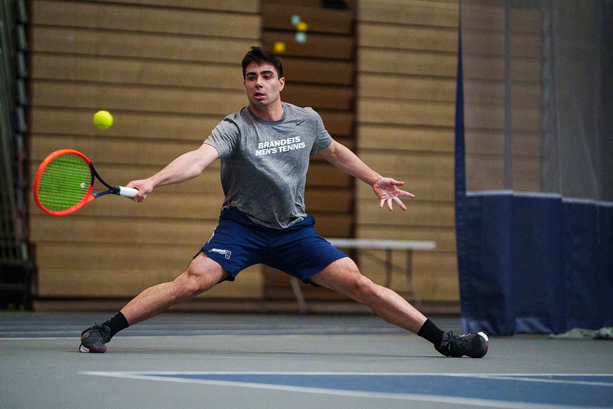 A tennis player mid-swing