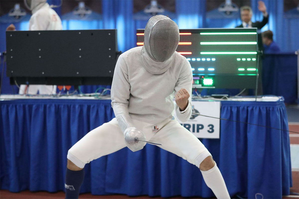 Lev BenAvram competes in a fencing match.