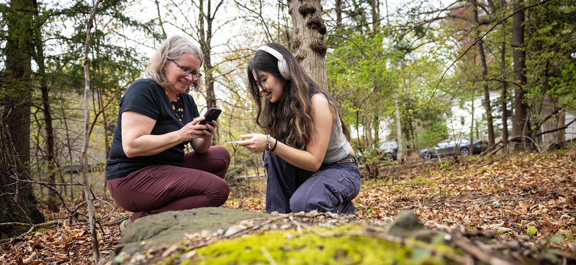 Professor Hitchcock and a student take photos of species.