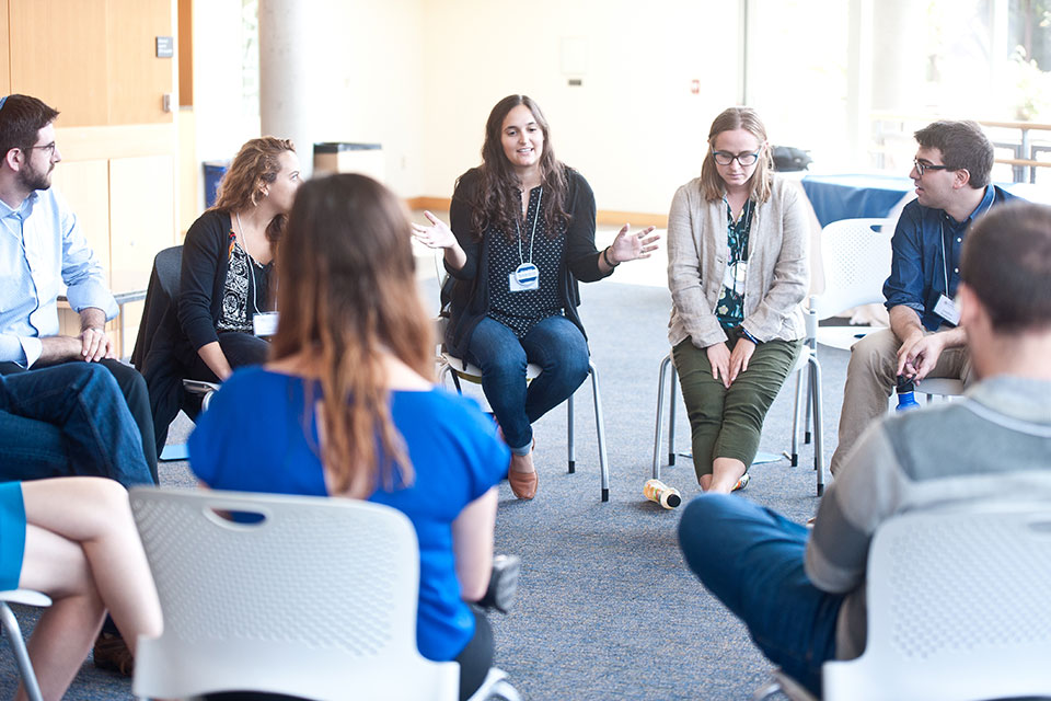 Students in the Hornstein program seated in a group talking