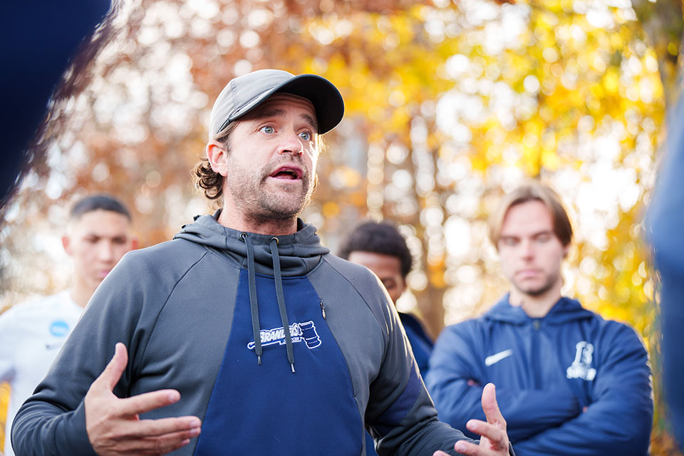 Head coach Gabe Margolis motivates his players during halftime against Stevens.