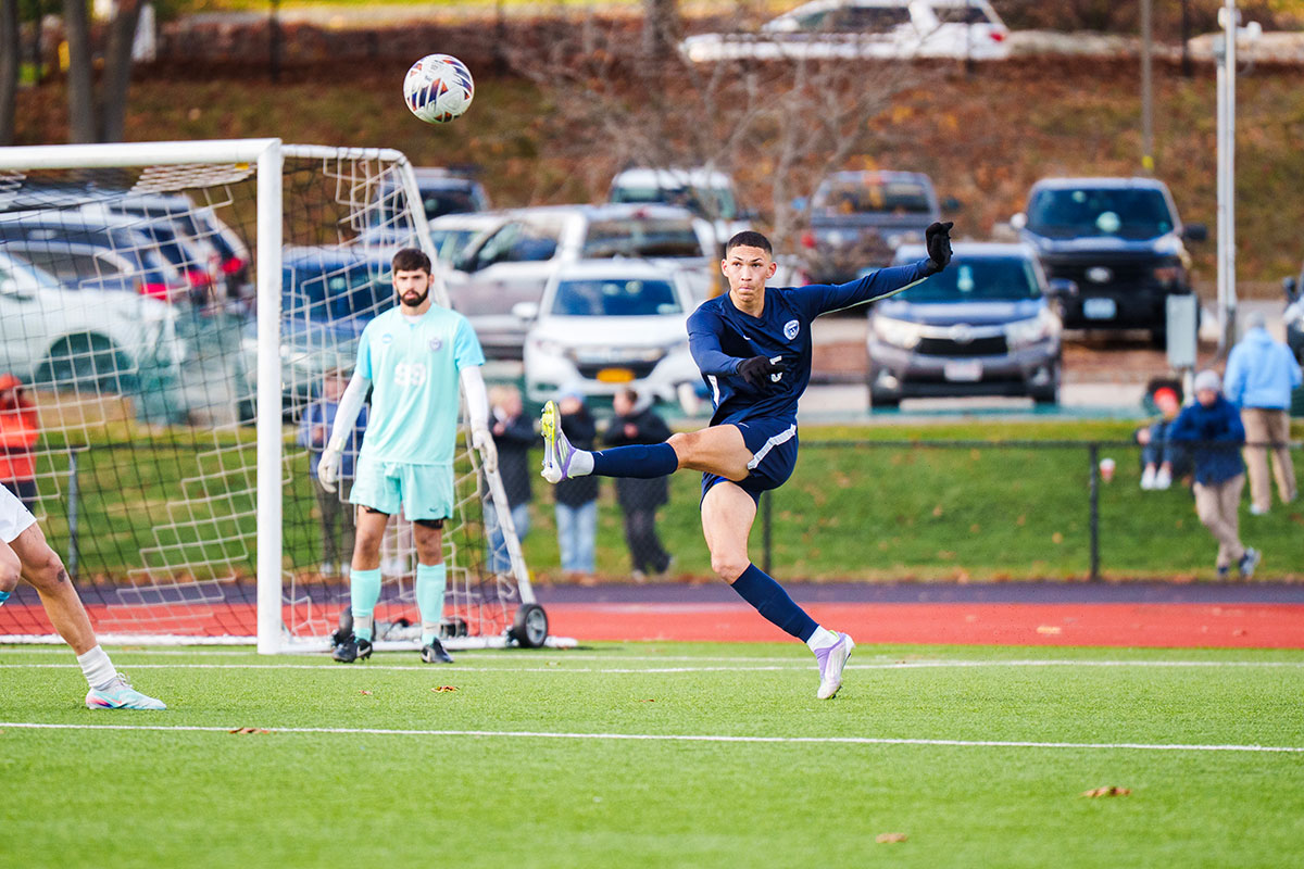 Dylan M. ’28 clears the ball away in the second round the NCAA Tournament.