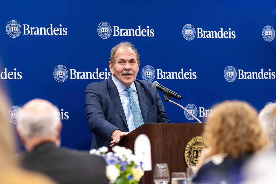 Arthur Levine speaks at a podium.