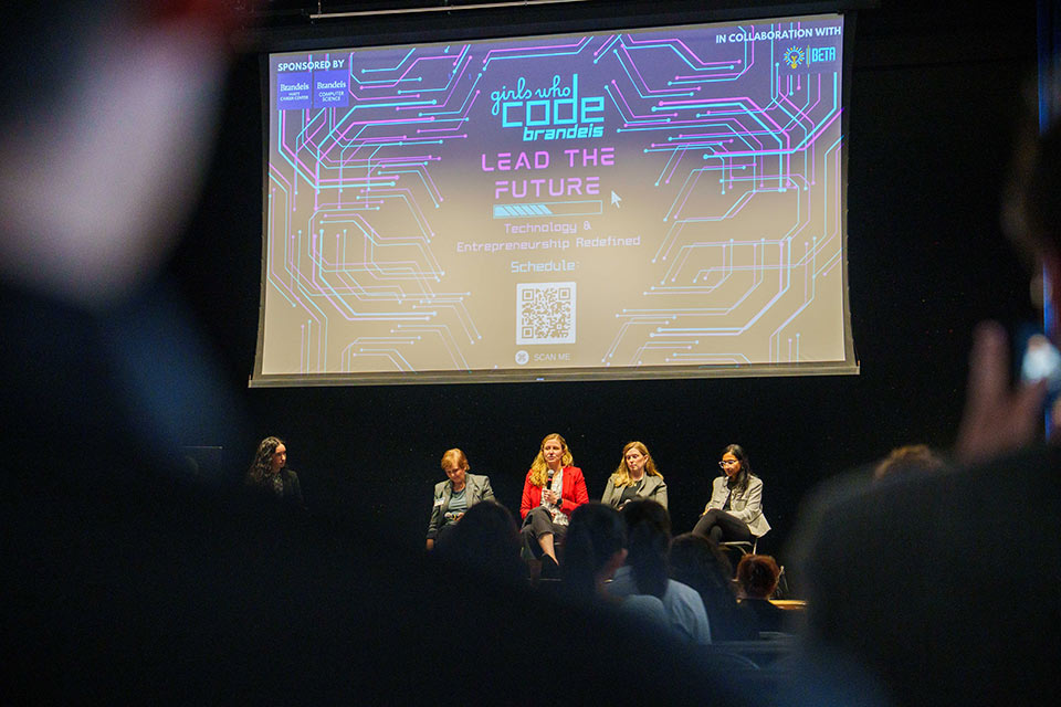 Panelists on stage during the event