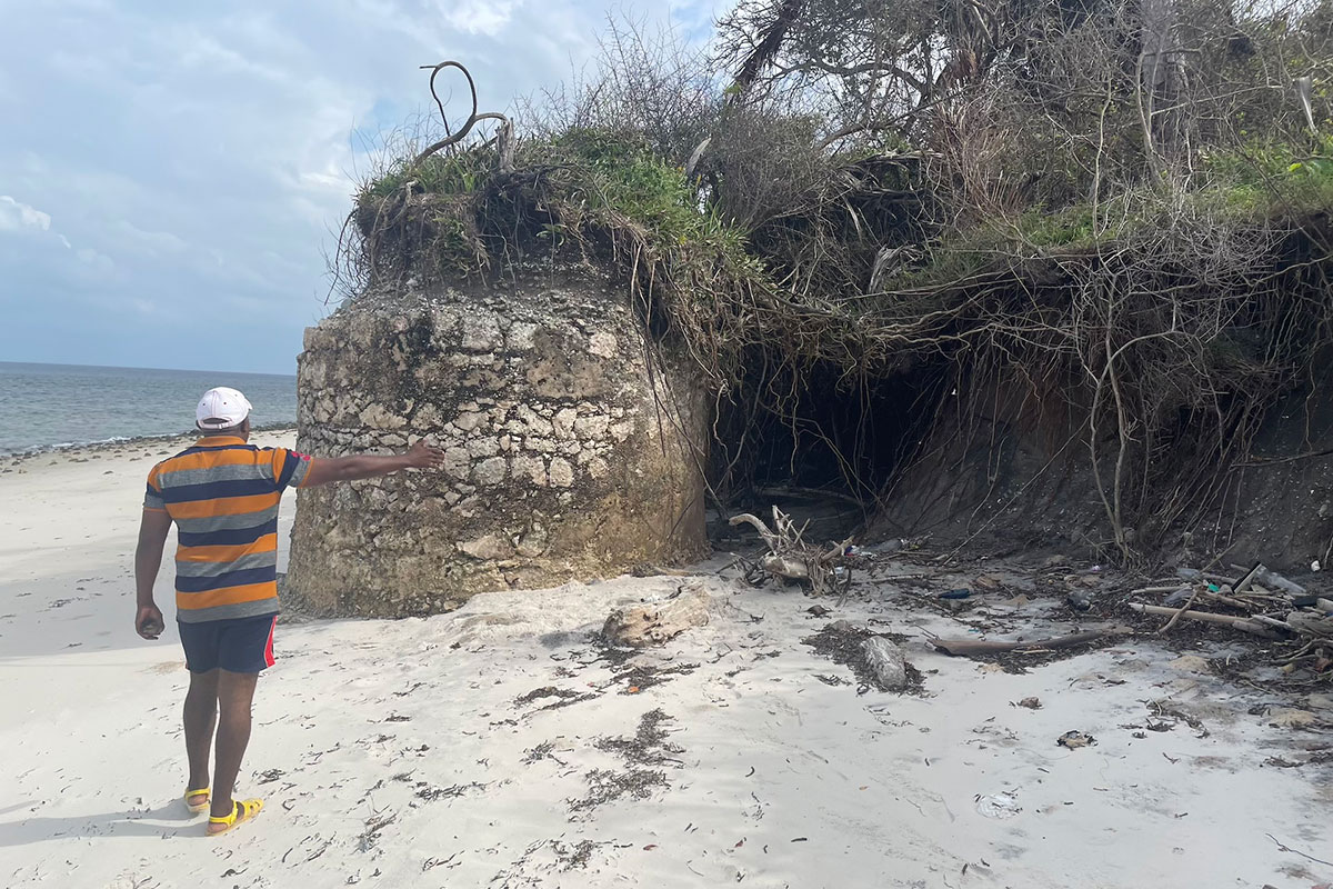 an ancient tower that is slowly eroding out of the sand at Mafia Island