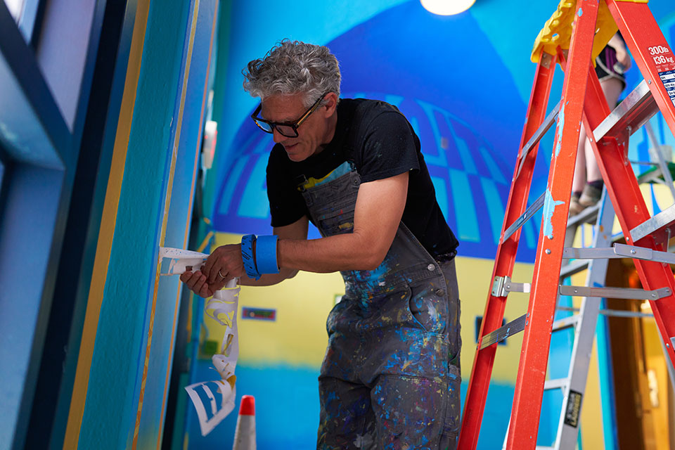 Artist painting in room