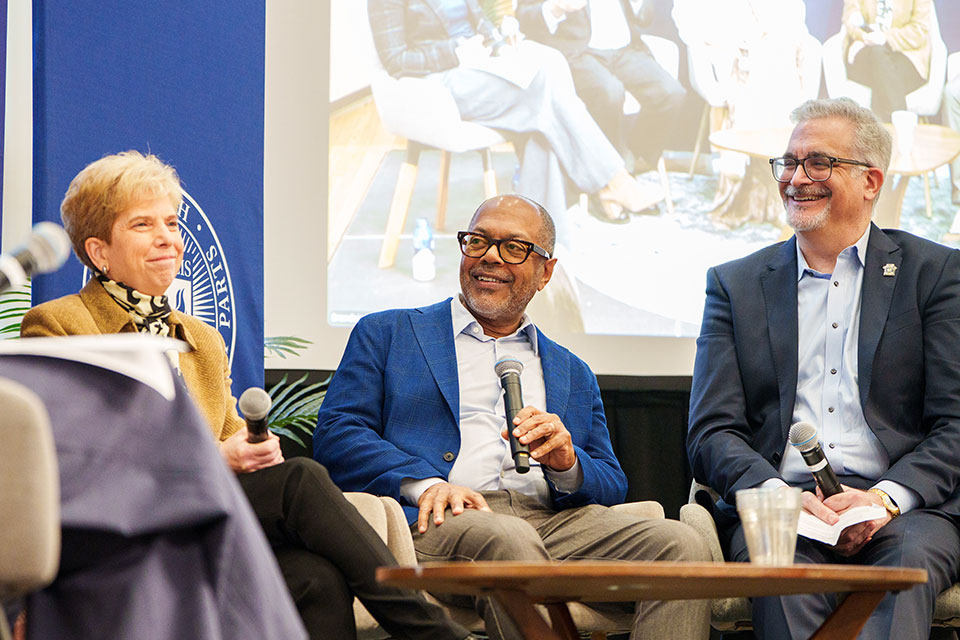 A panel of speakers sit on stage at Brandeis’ annual Carapezza lecture.