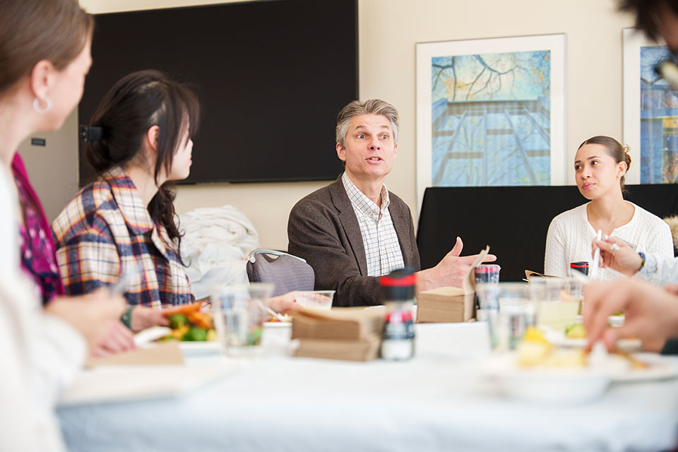 Professor talking to students 