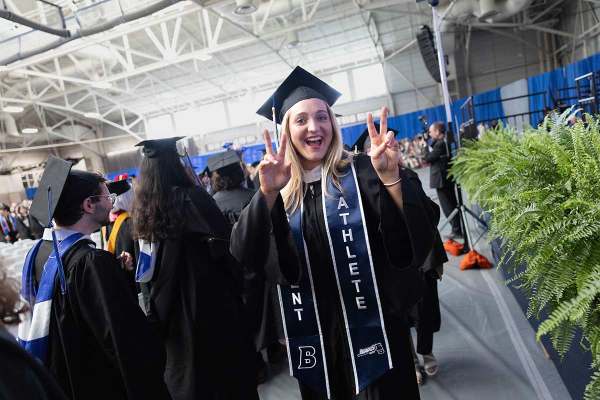 Graduating students smile as they walked into Gosman