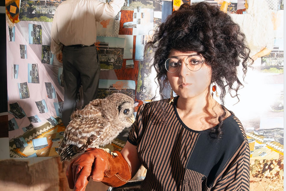 Woman holding an owl