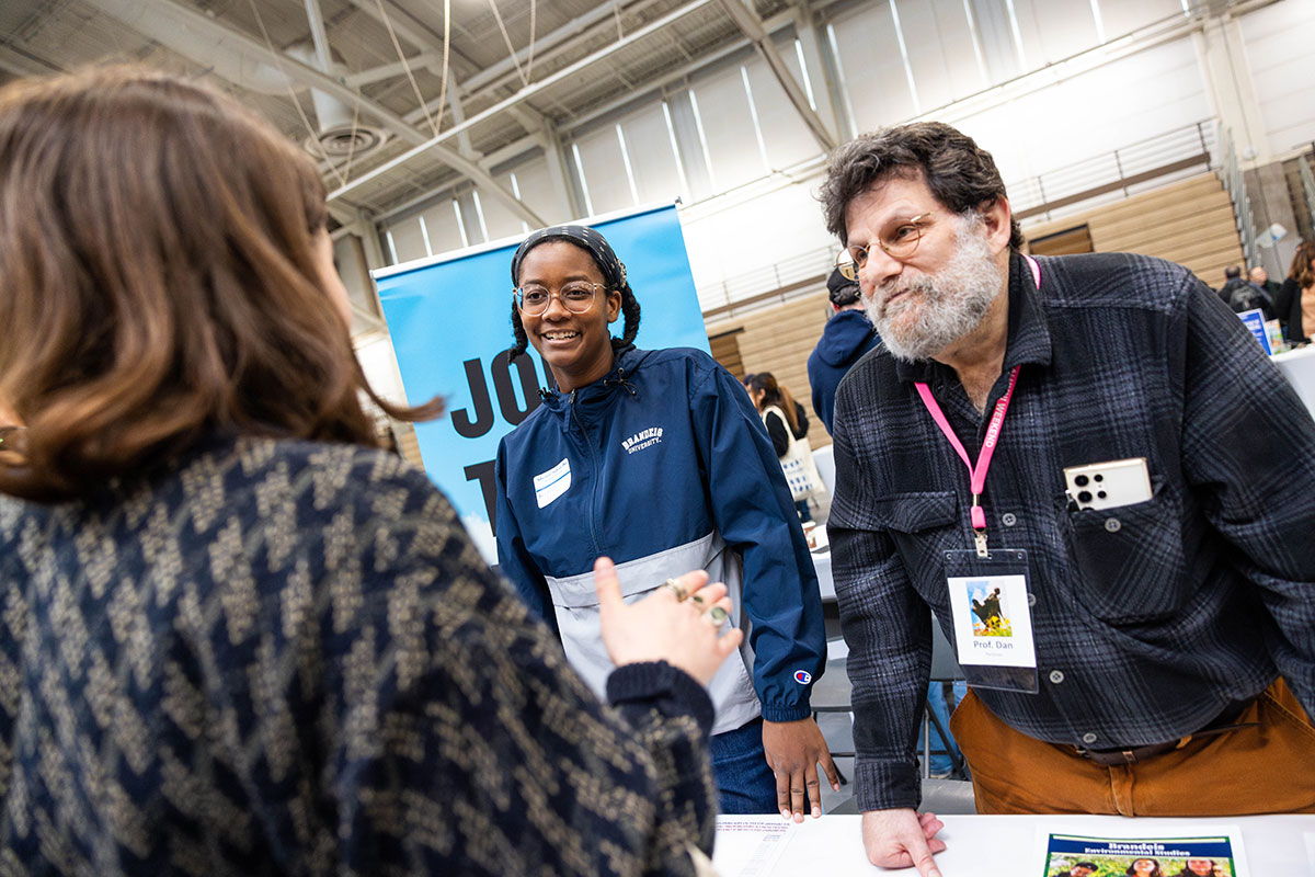 A current Brandeis student and professor speak to admitted students at Inside Deis Day in Gosman Sports and Convocation Center.