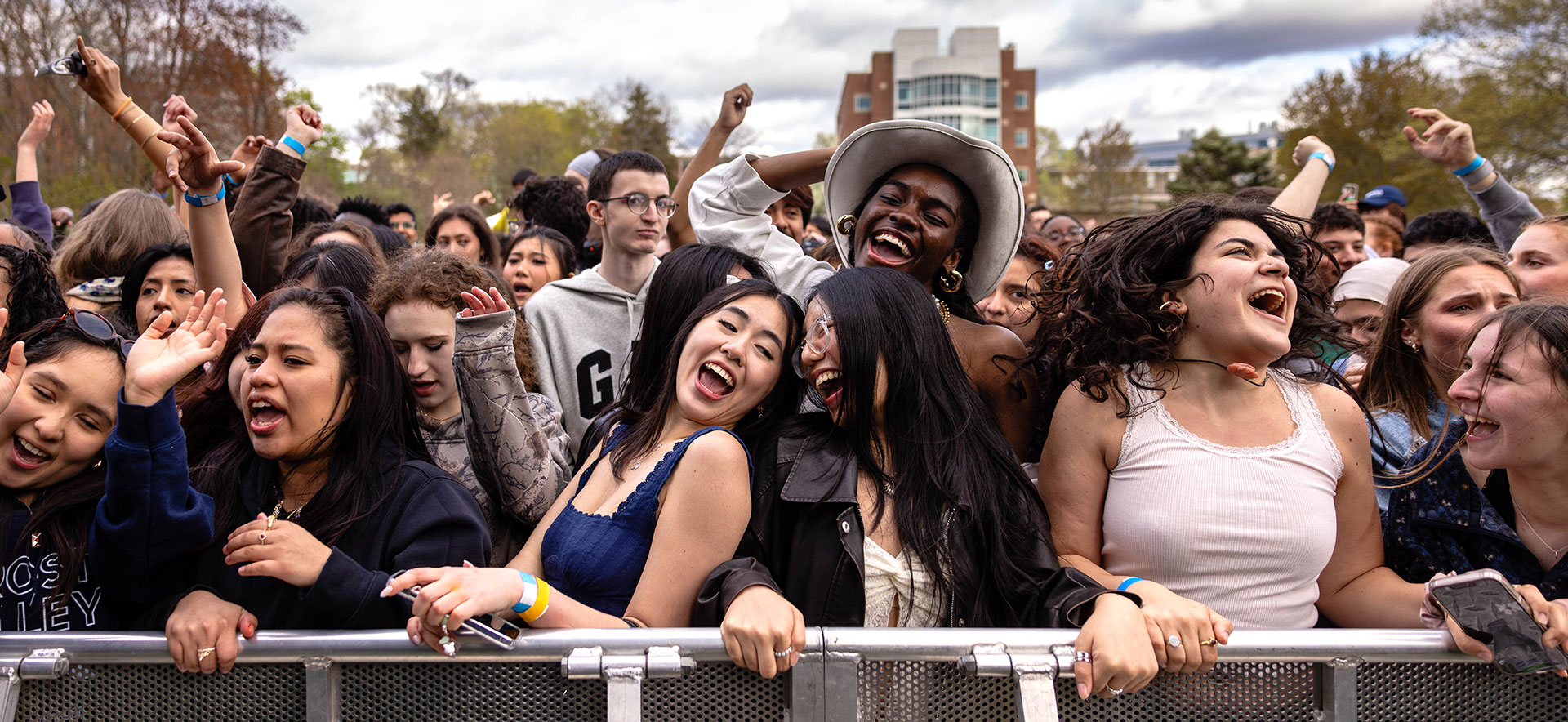 An audience of students dancing to a concert at Springfest.