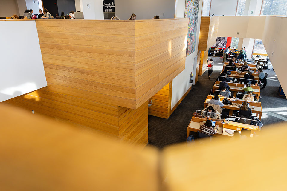 An aerial view of students studying in the library.