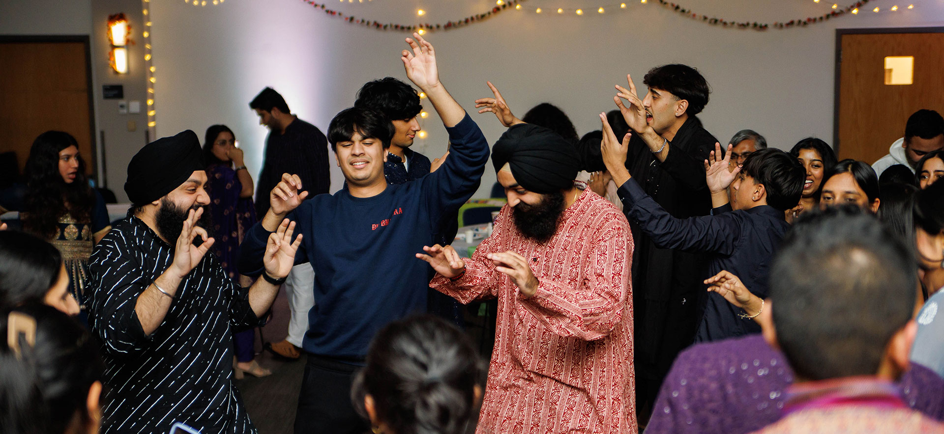 Students dance together during Diwali.