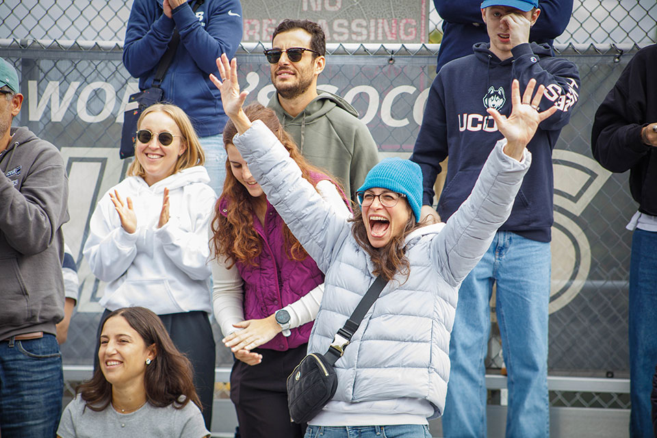 Fans cheer from the stands at Homecoming Weekend.