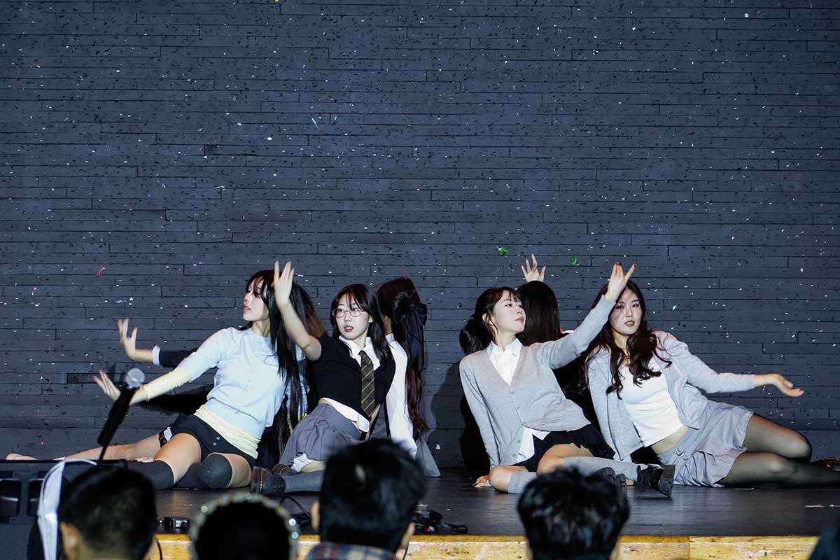 Students perform on stage during the Mid-Autumn Festival.