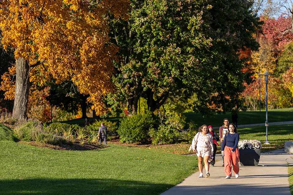 Students walk through the Brandeis campus.