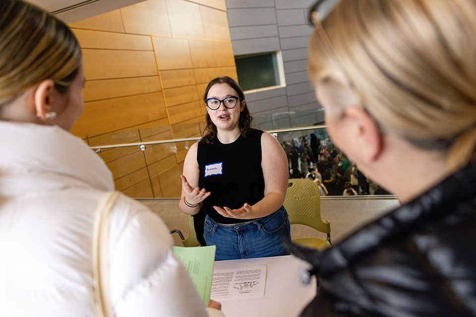 An Undergraduate Departmental Representative speaks with prospective students during Inside Deis Day.