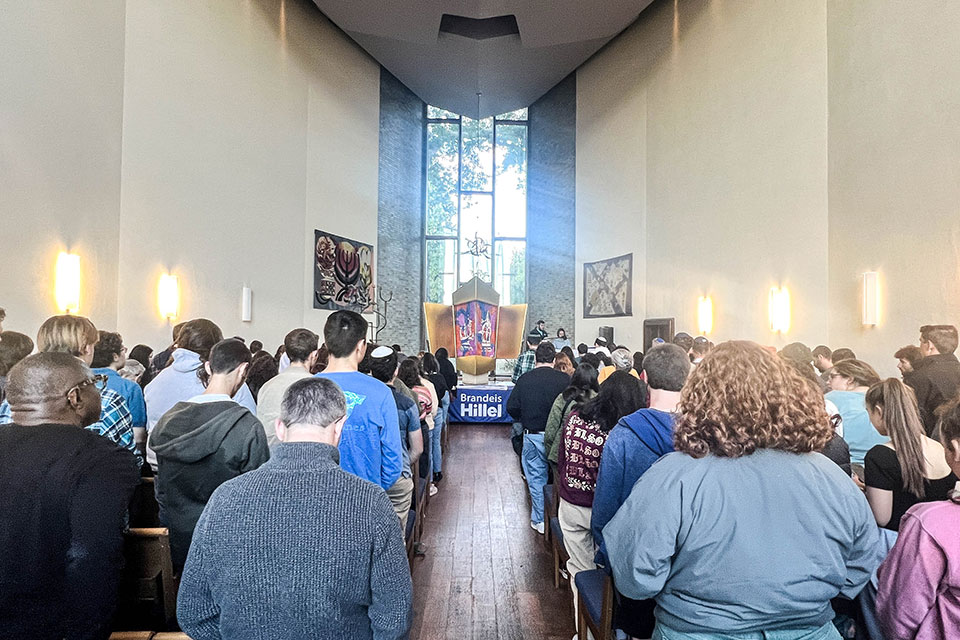 People gather in a chapel at a community gathering