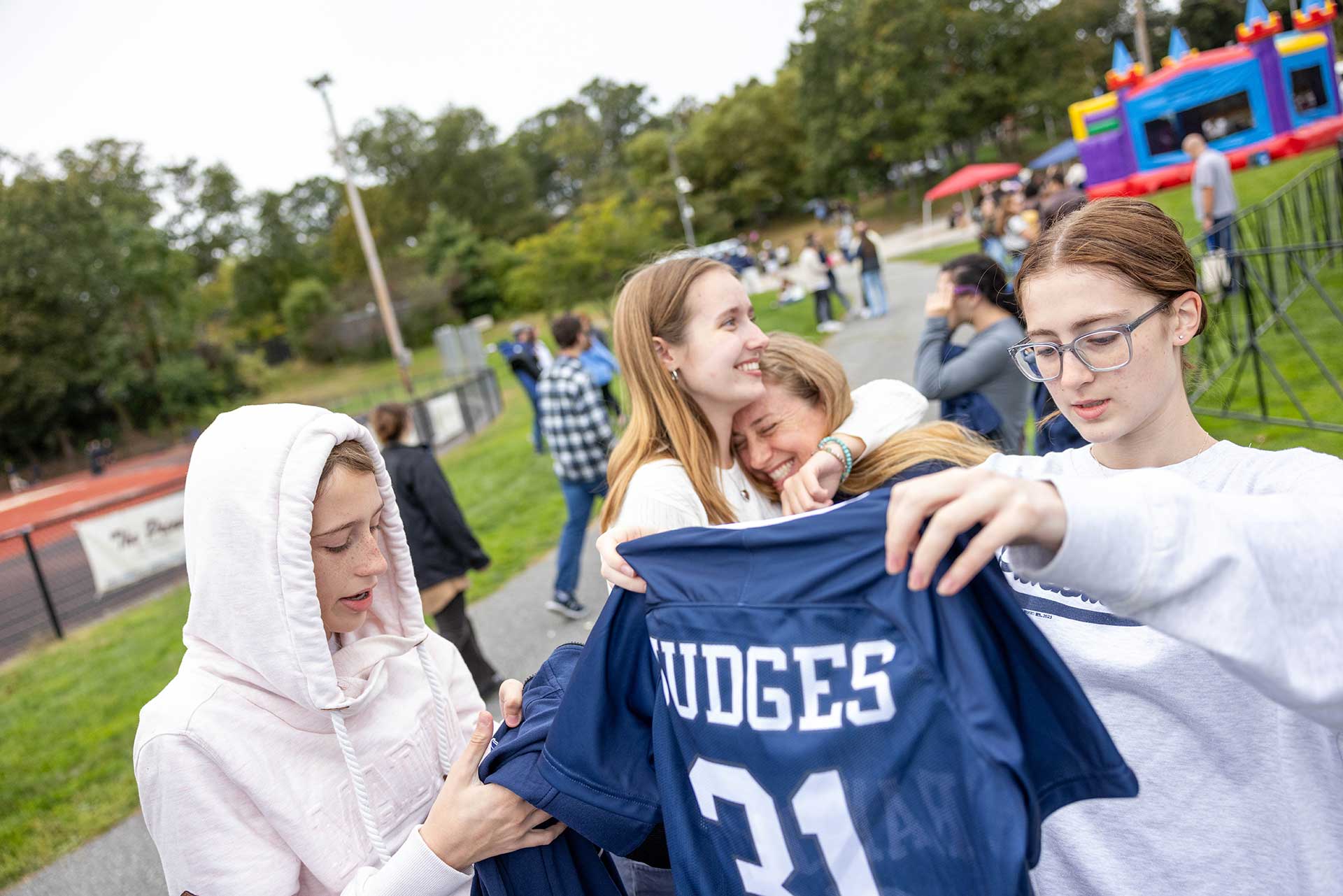 The Jack family looks at Brandeis spirit gear