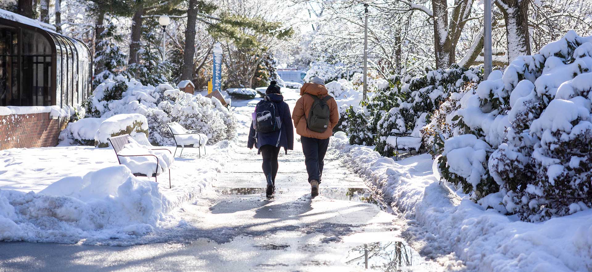 Students walking down a pathway in the snow