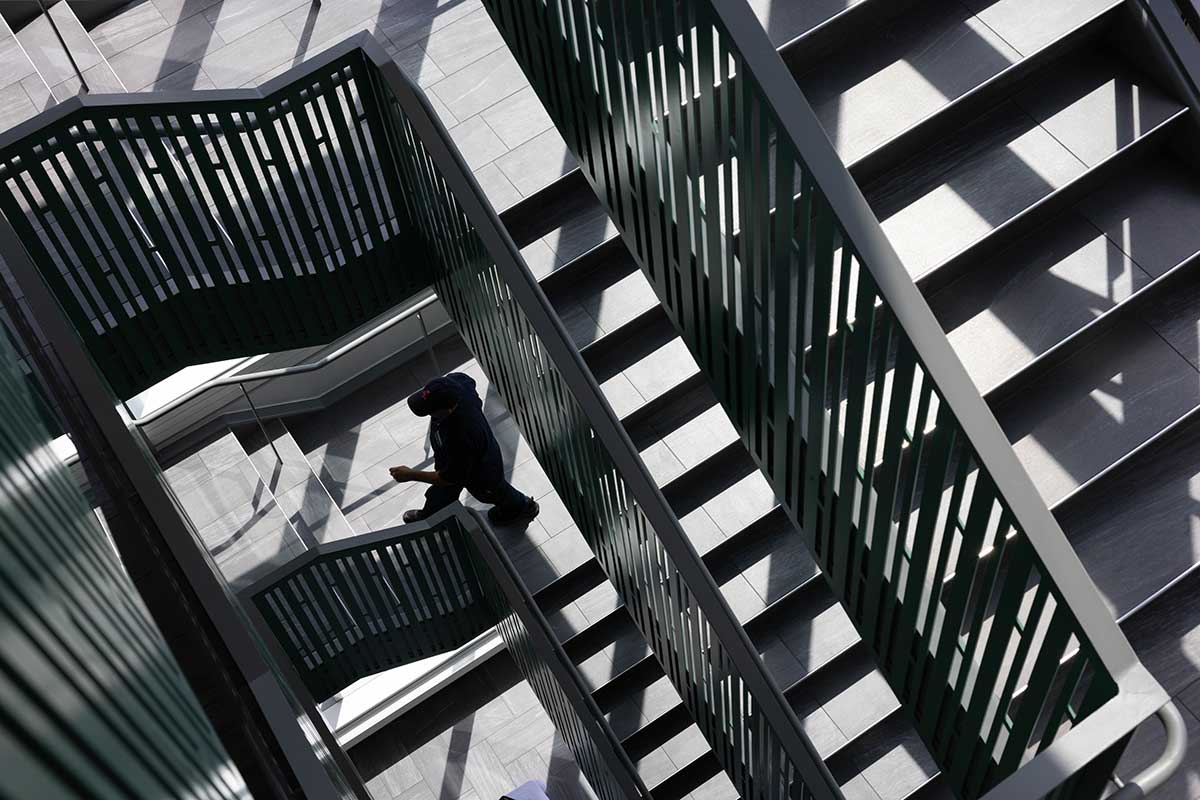 A person ascends the stairs at Skyline Residence Hall.