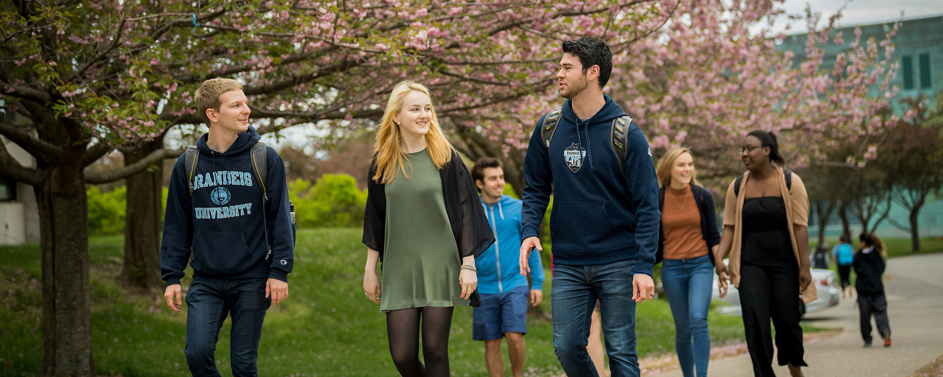 students walking on campus during spring