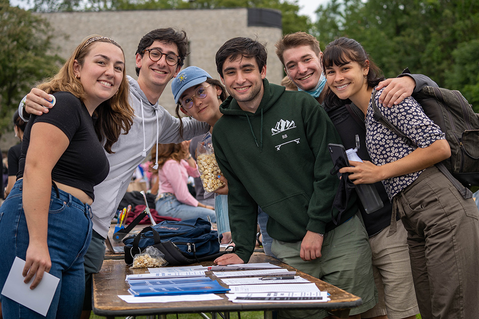 Smiling students outside at the fall Involvement Fair
