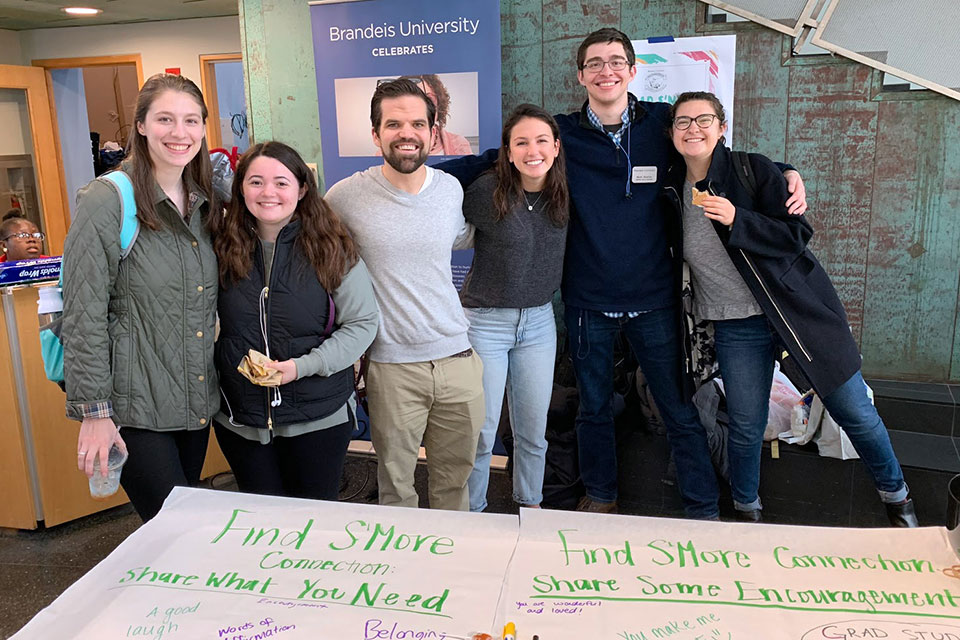 A group of students and staff smile during Kindness Day