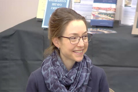 An image of Paola Tartakoff at the Jewish Studies Colloquium smiling off to the right.