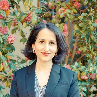 A headshot of Daniella Farah smiling at the camera.