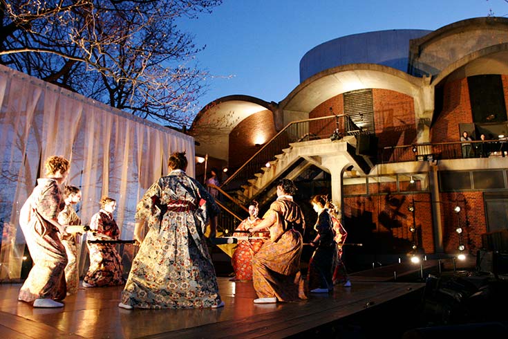 Actors outside of Spingold Theater performing The Bacchae