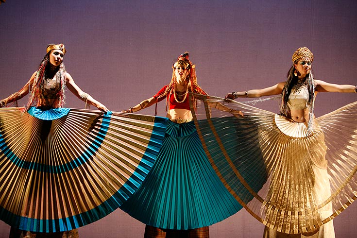 Three actresses wearing long skirts performing in Siddhartha