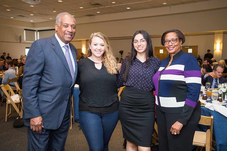 Trustees and students at an event