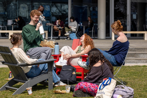students having a discussion outside