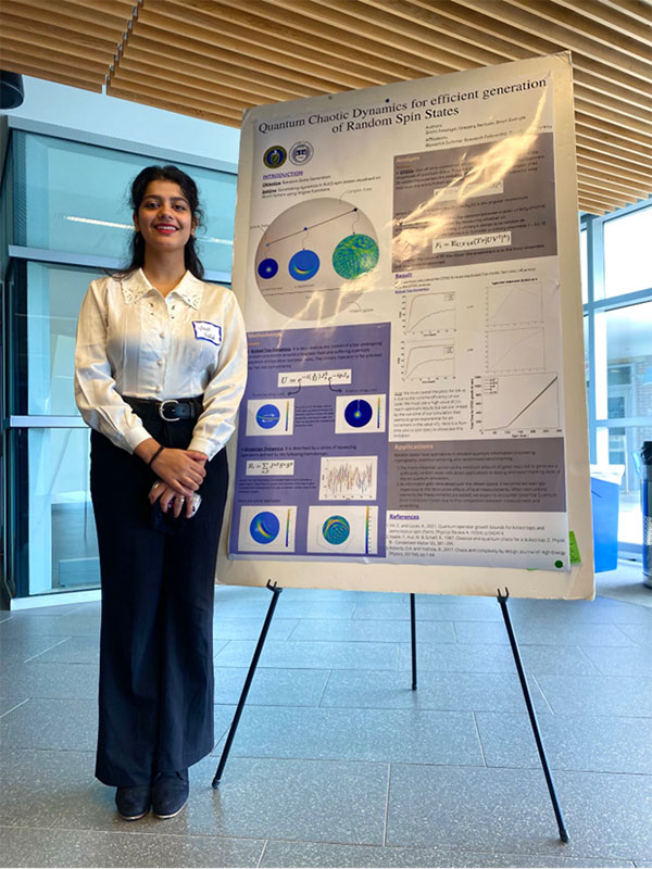 Srishti stands beside her poster at SciFest