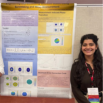 Srishti stands beside her poster at SciFest