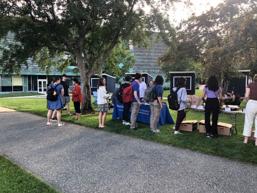 Hungry undergraduate researchers wait in line for delicious food.