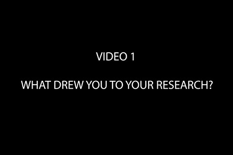 Black background with text that reads "Video 1: What Drew You to Your Research?"