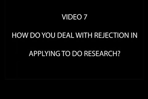 Black background with text that reads "Video 7: How do you Deal With Rejection in Applying to do Research?"