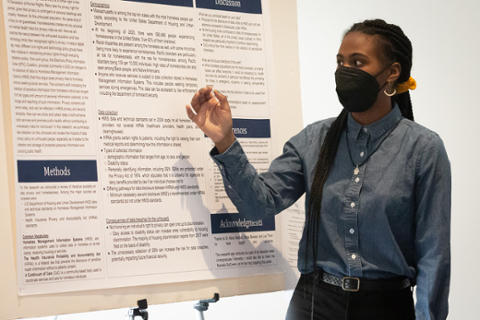 Brandeis undergraduate science student presenting poster.