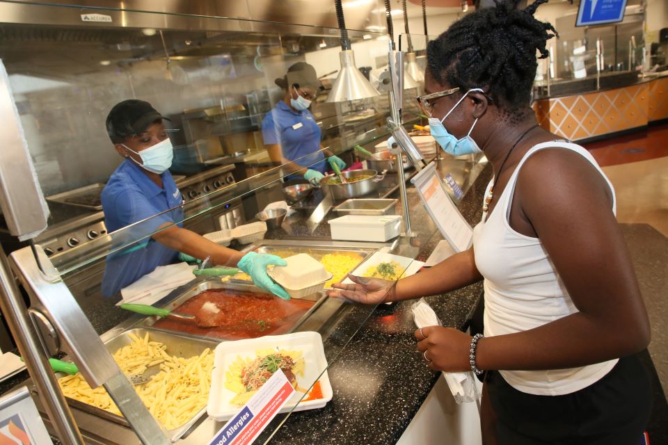 Kitchen employees fill plates