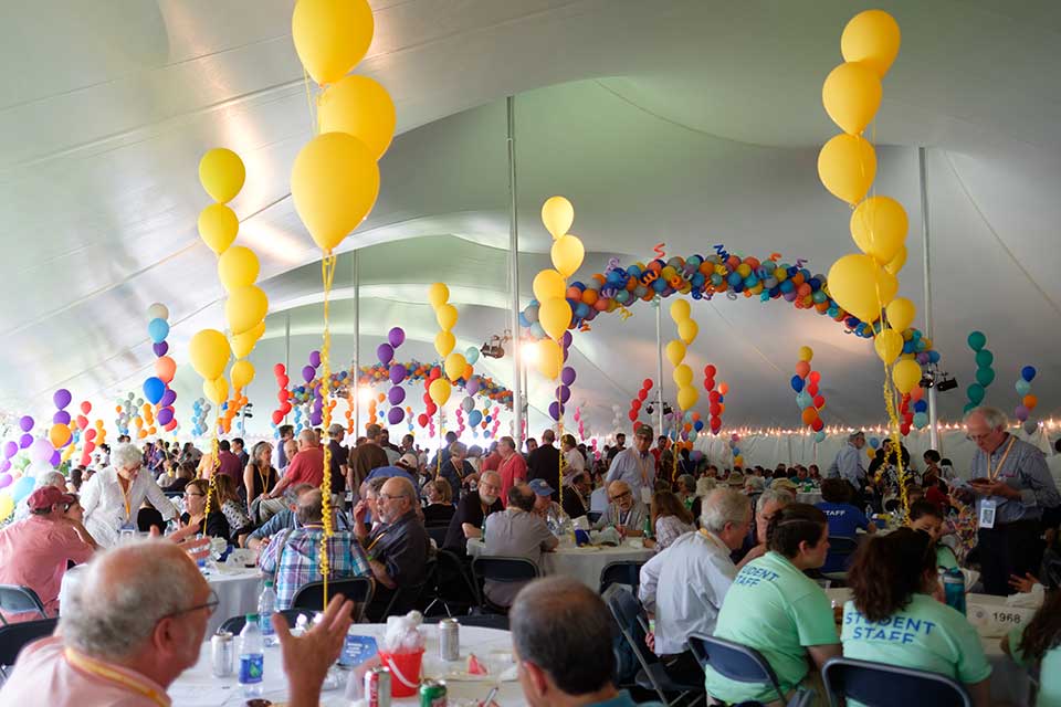 Room set up with balloons for a reunion