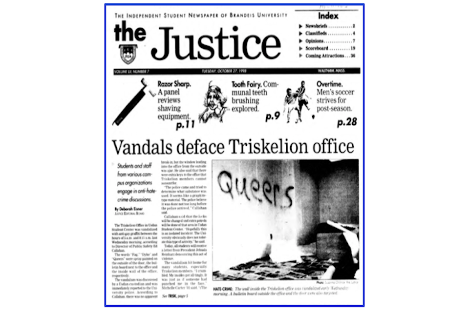 The front page of the Justice on Tuesday, October 27, 1998. The headline article by Deborah Eisner is "Vandals deface Triskelion office," featuring a black and white photo of the wall and corridor outside the office. The word "Queers" has been graffitied onto the wall and furniture has been knocked over. 