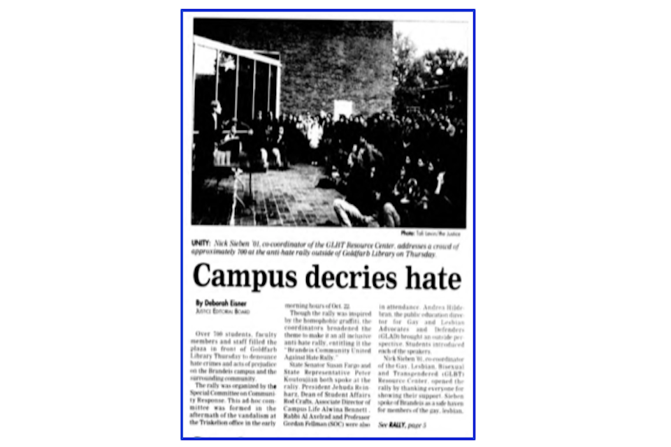 An article by Deborah Eisner from the Justice titled "Campus decries hate." The upper half is taken up by a black and white photo captioned Nick Sirben '01, co-coordinator of the GLBT Resource Center, addresses a crowd of approximately 700 at the anti-hate rally outside of Goldfarb Library on Thursday." 