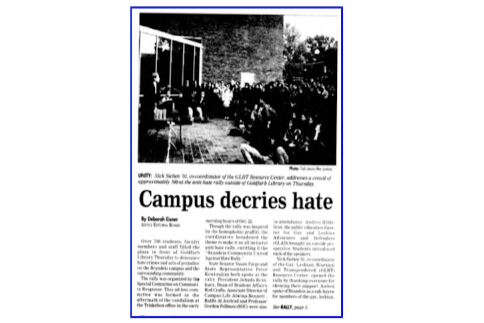 An article by Deborah Eisner from the Justice titled "Campus decries hate." The upper half is taken up by a black and white photo captioned Nick Sirben '01, co-coordinator of the GLBT Resource Center, addresses a crowd of approximately 700 at the anti-hate rally outside of Goldfarb Library on Thursday."