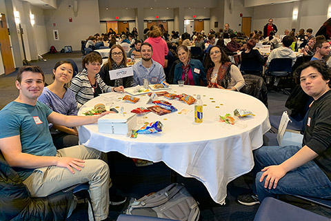 students seated at hebrew-language table