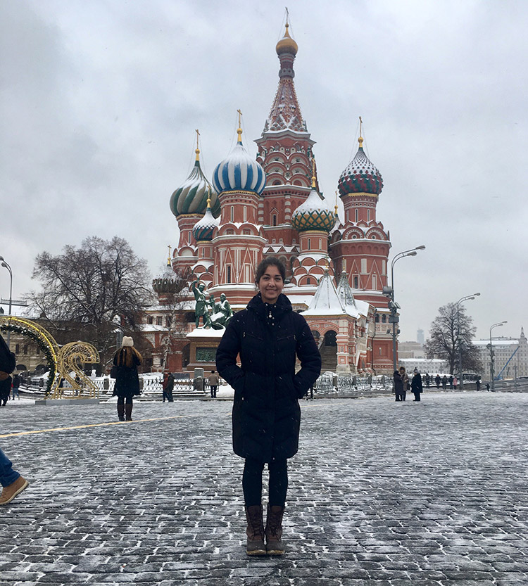 jennifer ginsburg poses in front of russian building